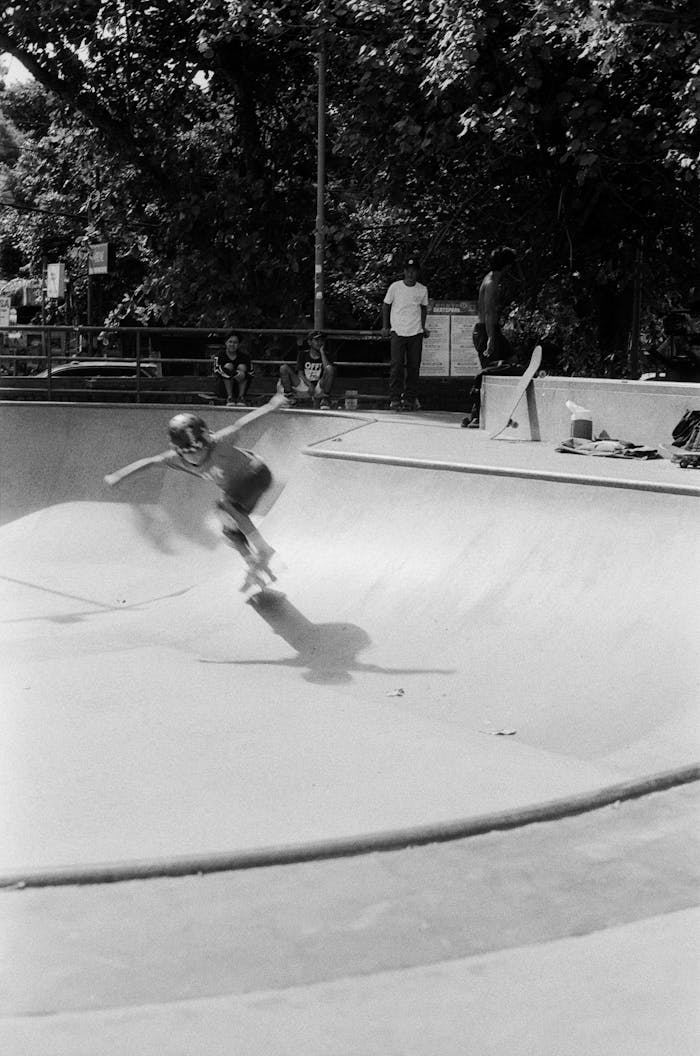 A skater in motion captured in black and white at a Bali skatepark, showcasing energy and skill.